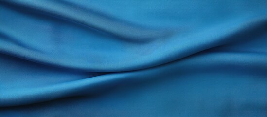 Fototapeta premium Top view of a blue fabric texture background with ample copy space for work and design purposes