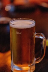 Closeup of a mug of cold beer at bar