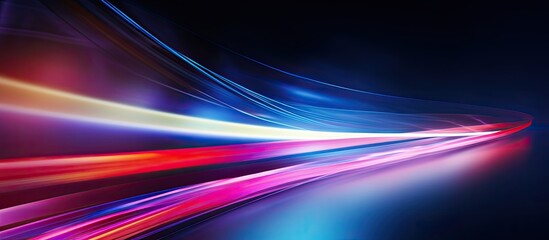 Colorful light trails create a blurred background and provide ample copy space for an image