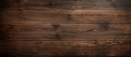 An aged pattern on a dark wooden surface creates a textured background perfect for a copy space image