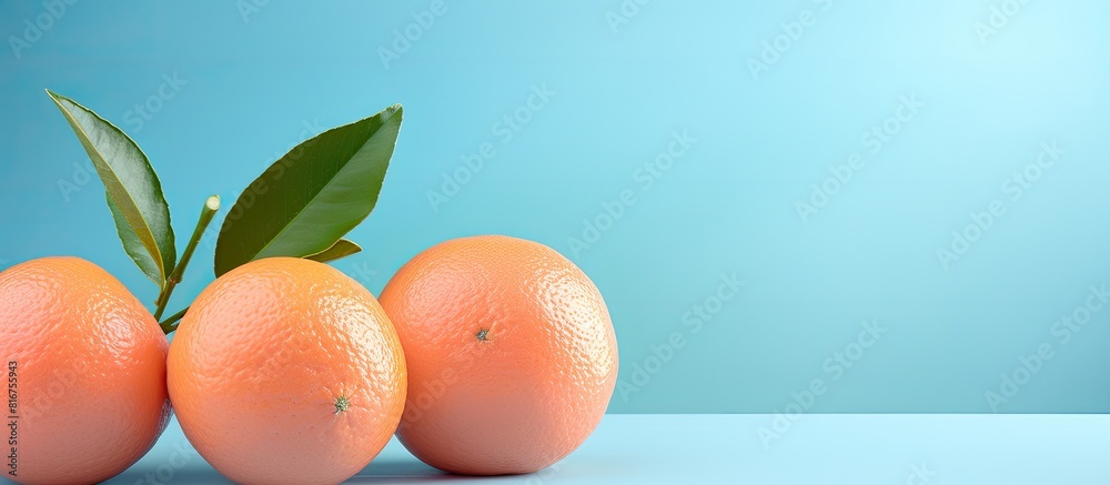 Aufkleber isolated tangerines put diagonally on a pink and blue background with copy space on each side