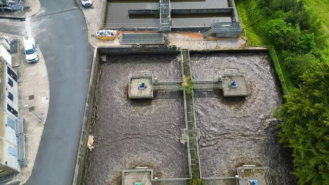 Drone shot above a waste water treatment plant of a small town in the United Kingdom