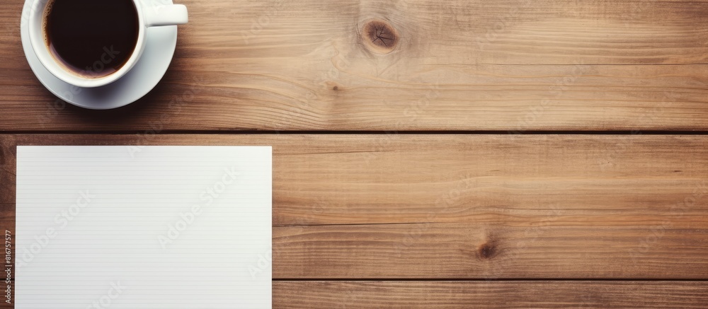 Aufkleber note paper pen a cup of coffee and a smart phone on a wooden table. copy space available