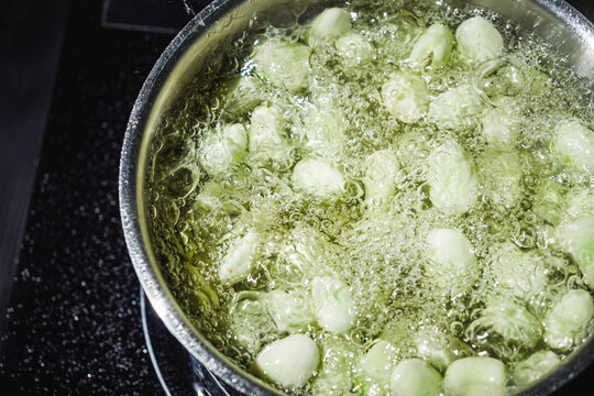 fresh greens broad beans fava boiled on a dark background
