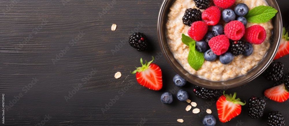 Aufkleber A fresh and healthy meal of oatmeal porridge with chia seeds and berries is displayed on a table creating a vibrant and appetizing food background with copy space image
