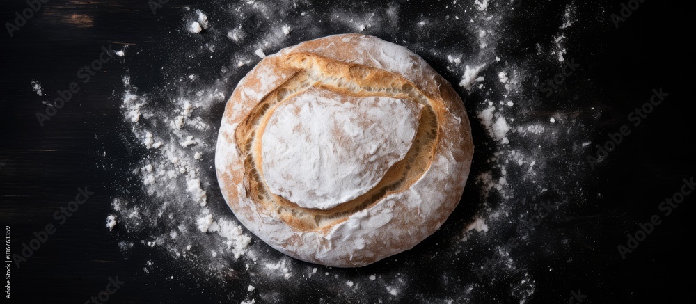 Aufkleber Round rye bread and white flour around isolated on black table background top view empty copy Space for text
