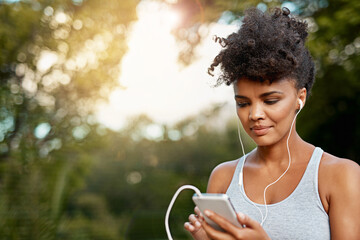 Fitness, black woman and cellphone with headset for listening music, podcast and radio with smile....