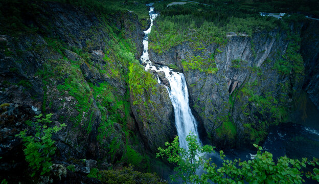 Atmospheric Cascade: Aerial View of Wild Waterfall in Moody Scandinavian Summer