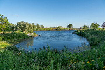 a large pond with some water in the middle of it