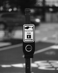 Close-up of a traffic lights button in Seattle, Washington, USA in grayscale