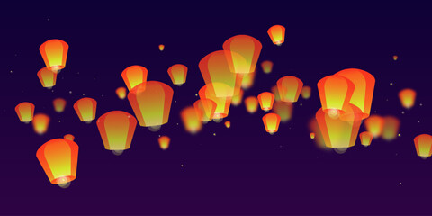 Naklejka premium Sky lanterns floating in the night sky.