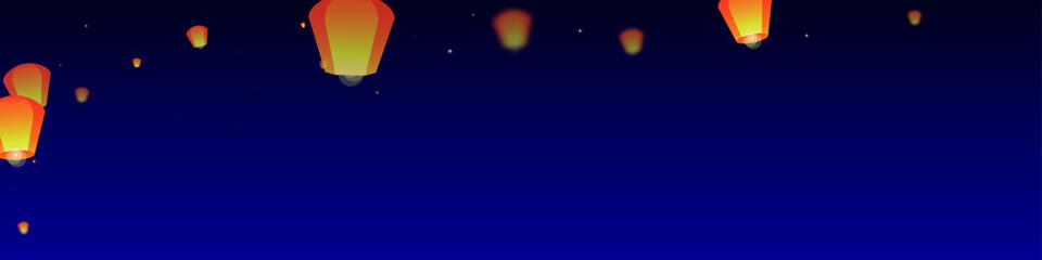 Sky lanterns floating in the night sky.