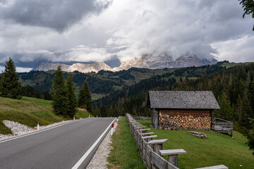 View of a winding mountain road near the Campolongo Pass in the Dolomites Mountains of South Tyrol