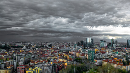 Dark stormy clouds over Milan city. Amazing views of the dramatic skyline of Milan. Climate change concept. Italy, Lombardy, Milan 05.2024