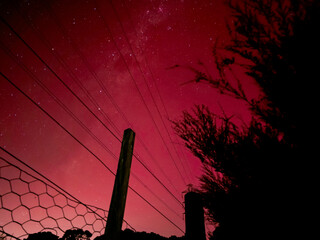 Milky Way through pink Aurora Australis 