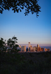 Fototapeta premium Aerial view of the beautiful skyline of Downtown Austin, Texas illuminated by the golden sunset
