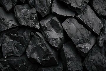 Closeup black and white photo highlighting the textures of coal