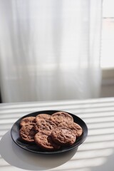 Chocolate cookies in the kitchen sunlight
