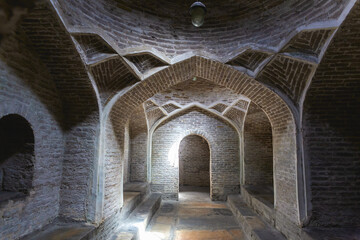 Bukhara, historical bath (hammam). Arched brickwork and intricate vaulting with subtle lighting....