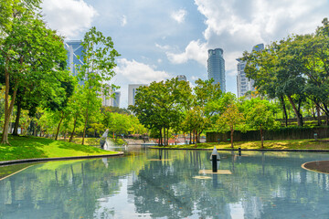Scenic artificial lake in a green city park, Kuala Lumpur