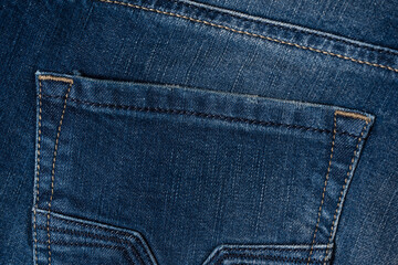 Fototapeta premium Blue jeans denim texture as a background. Top view.