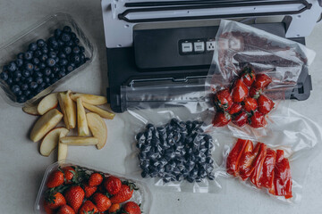 fresh berries in a vacuum bag with a vacuumiser machine