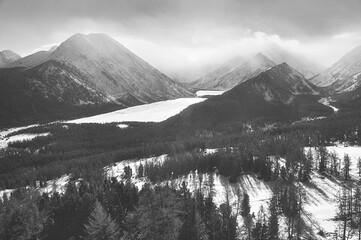 Snow-covered winter mountain lake, Russia, Siberia, Altai mountains.