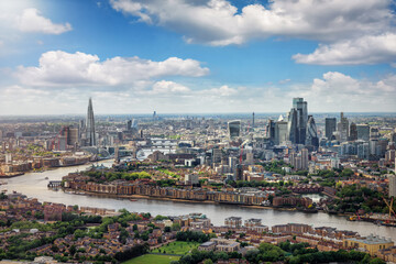 Elevated panorama of the London skyline along the river Thames from London Bridge until the City...