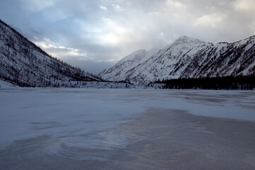 Snow-covered winter mountain lake, Russia, Siberia, Altai mountains.