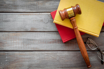 Wooden judge gavel and law book. Court of justice and law concept
