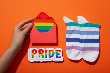 LGBT parade concept, symbols on orange background.