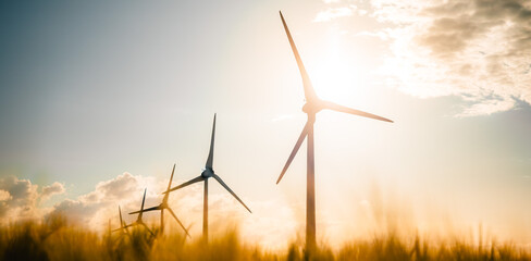 Wind turbines farm, wind power energy generation equipment, clean energy concept. Windmills in the...