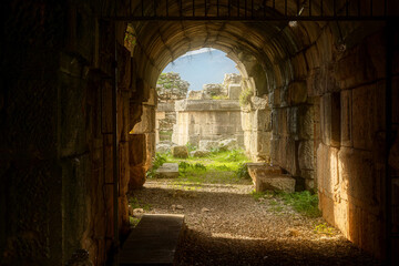 Ancient archway with sunlight illuminating