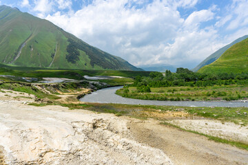 Road covered with mineral salts, Terek river in the valley