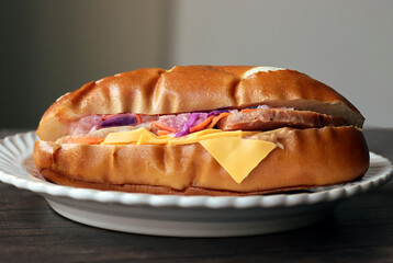 Close-up of lye breaded chicken sandwich on white plate
