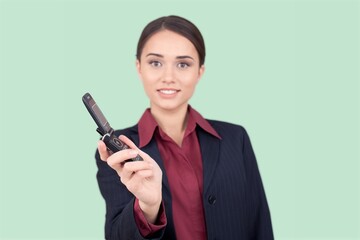 A young happy woman hold a smartphone