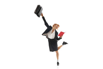 Businesswoman standing in dynamic pose with briefcase and looking on notebook isolated on white background. Multitasking and efficiency. Concept of business, office lifestyle, deadlines, motivation