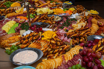 Various breads and meats served on giant platter