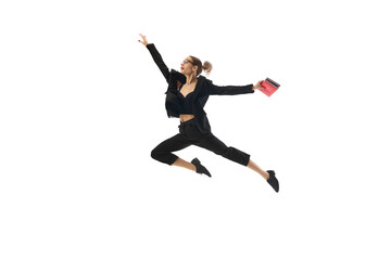 Dynamic image of motivated and enthusiastic woman in formal wear, in mid-air pose reaching professional success and growth isolated on white background. Concept of business, office lifestyle