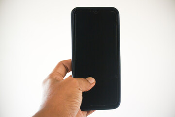 Hand holding a black cellphone