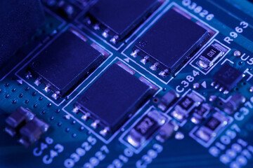 Close-up view of an integrated circuit mounted on a green printed circuit board.