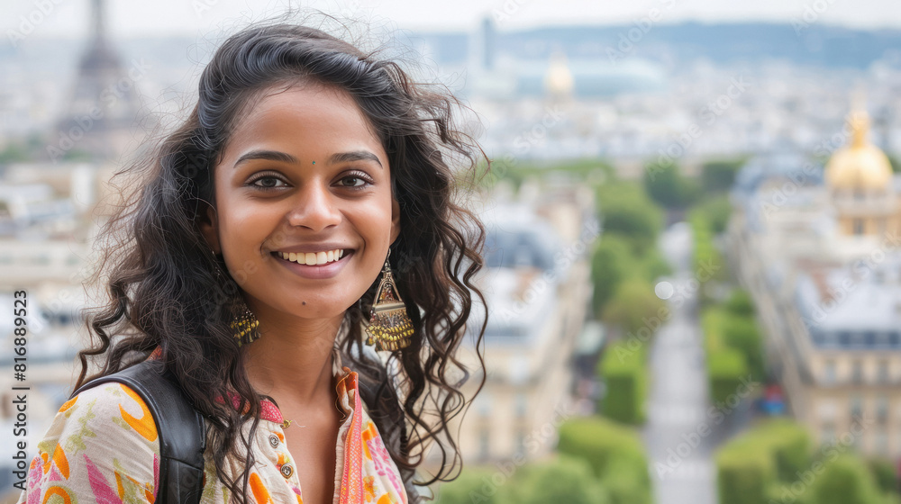 Wall mural beautiful woman standing on eiffel tower background