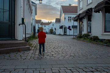 Family visiting Mandal in Norway, enjoying views, kids playing on sunset