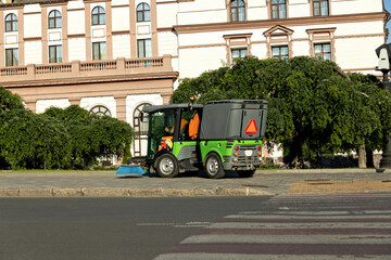 Street cleaning machine in sunny weather.