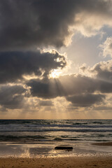 Beautiful Mediterranean Sea with God's rays at sunset at the coastline near Haifa, Israel 
