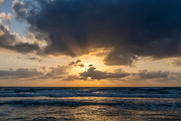 Beautiful Mediterranean Sea with God's rays at sunset at the coastline near Haifa, Israel 

