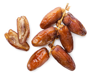 Dried dates fruits and halves on a white background. Top view