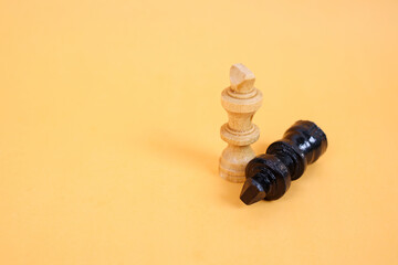 One black and white chess piece on yellow background