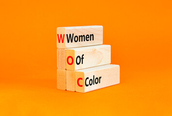 WOC women of color symbol. Concept words WOC women of color on beautiful wooden blocks. Beautiful...