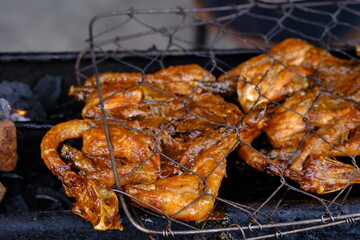 ayam bakar Taliwang is Taliwang grilled chicken is a typical food of Lombok and Sumbawa, West Nusa Tenggara. Spicy shrimp paste chicken. Indonesian food. 